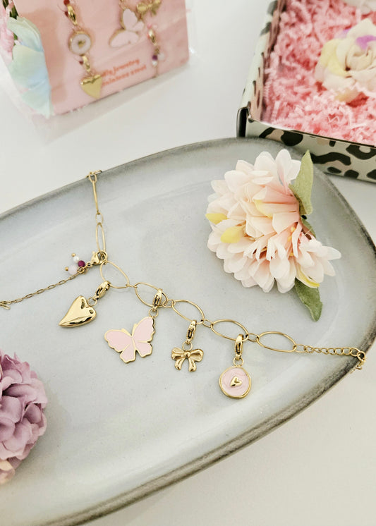 Goud armbandje met bedels vlinders